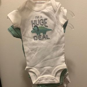 Carters newborn green and grey dinosaur print.